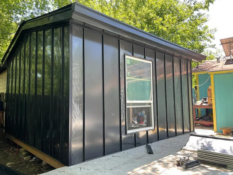 Black standing seam metal wall panels for Roof Inspection in Fort Scott